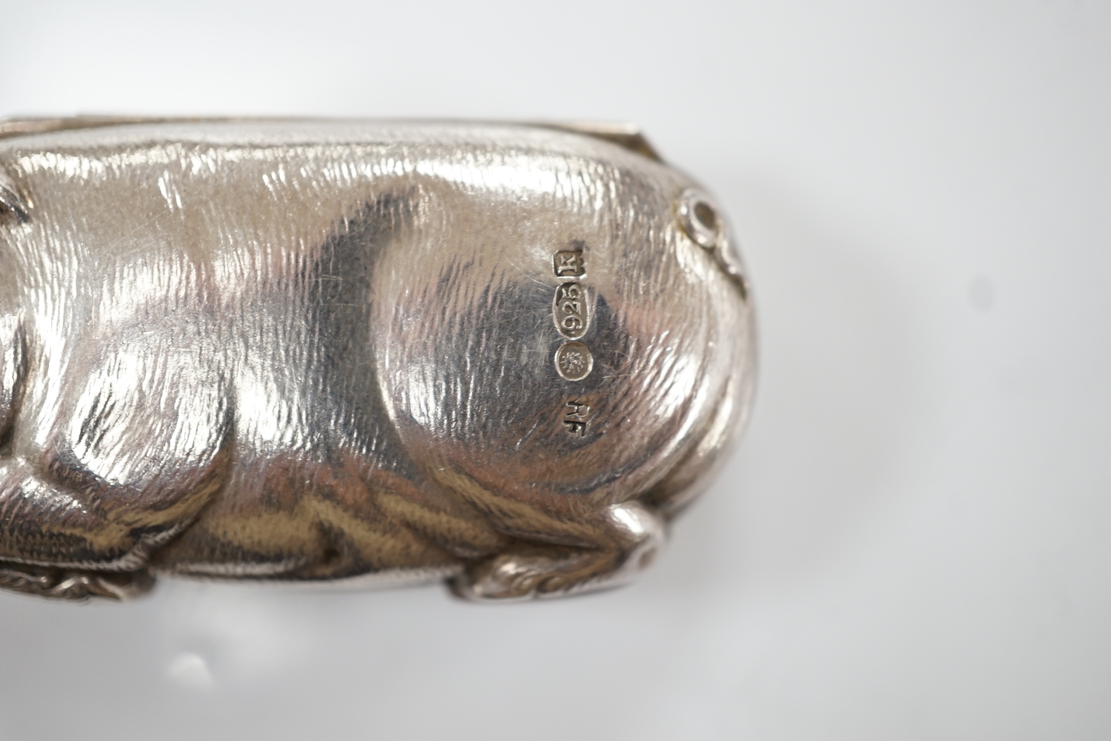 An Edwardian novelty silver sovereign/half sovereign case, modelled as a pig, import marks for Robert Friederich, London, 1905, 63mm.